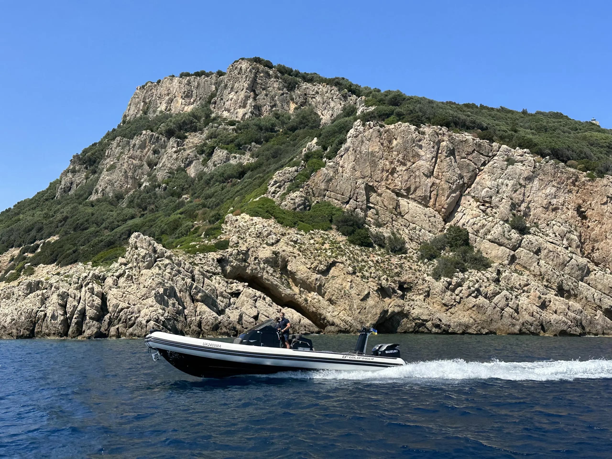 Brig Eagle 10 at speed past dramatic cliff face in Sardinia