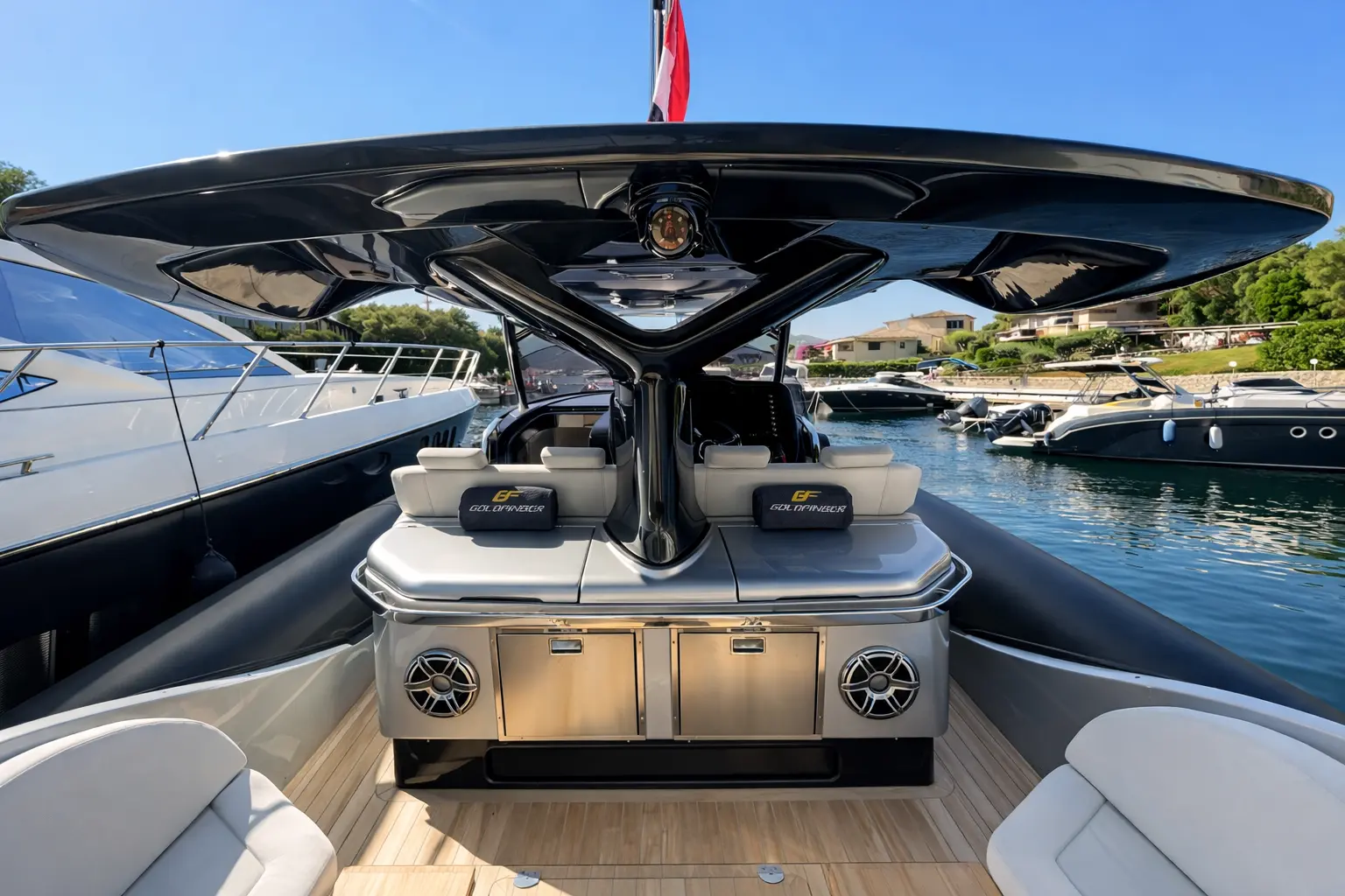 SACS Strider 15 cockpit view with teak deck, helm console, and bimini hardtop