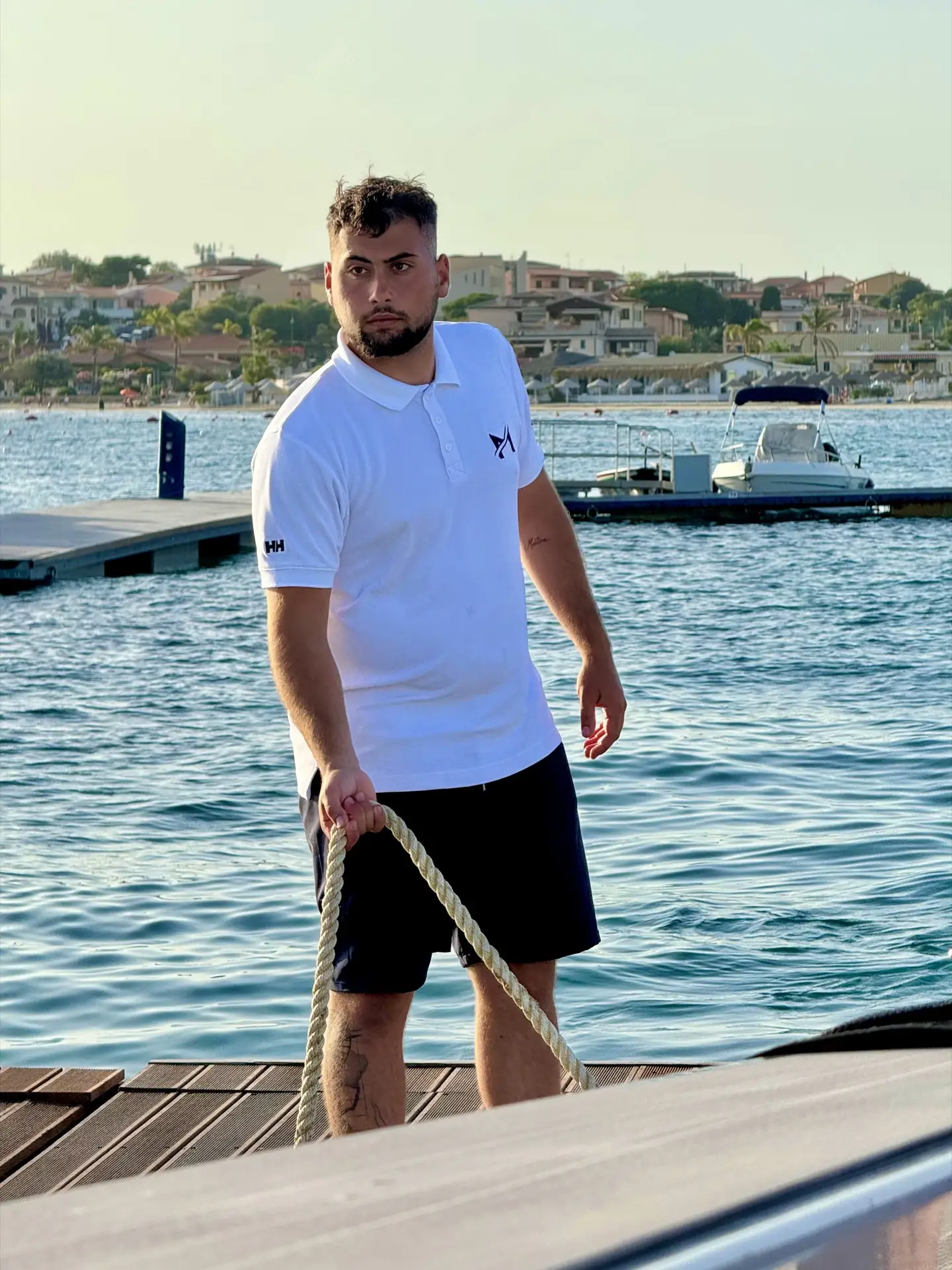 Lorenzo from MareFun handling dock lines at the harbour at sunset