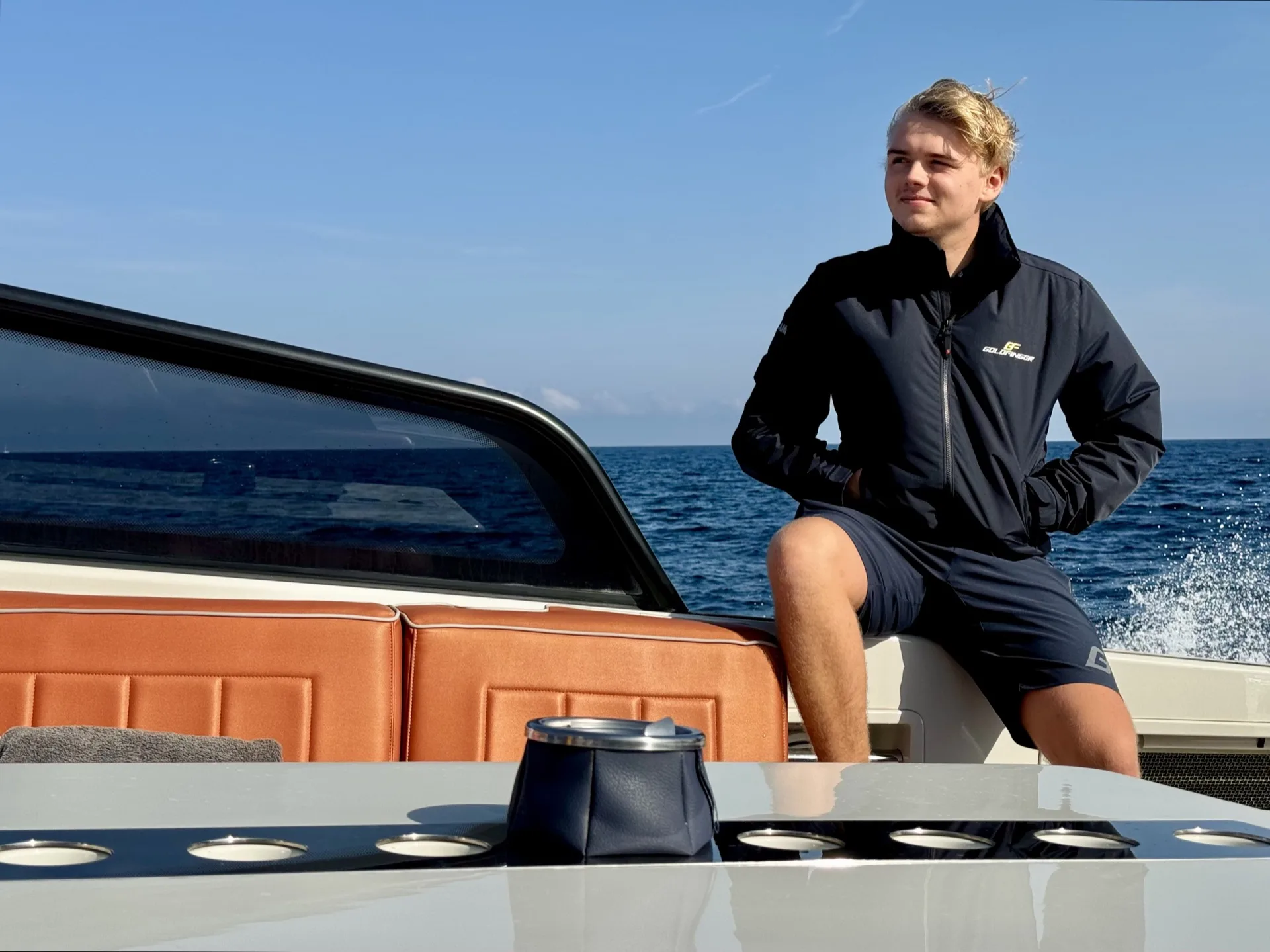 Valentijn seated on the stern of a MareFun charter yacht at sea