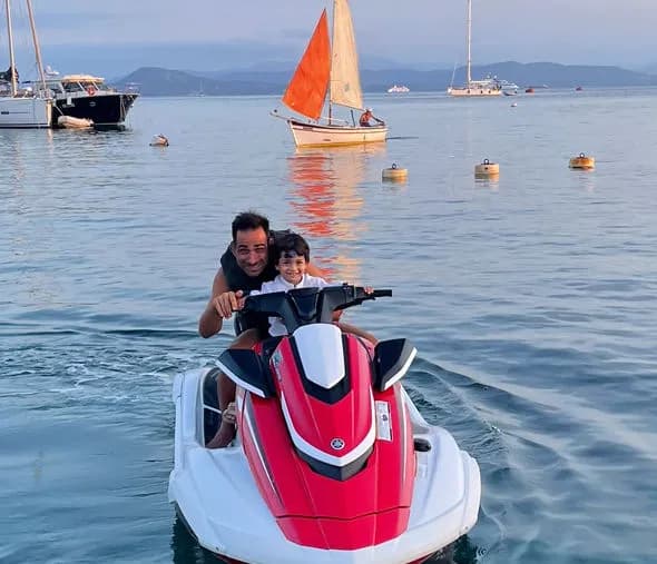 Marco on JetSki with his 3 year old Son